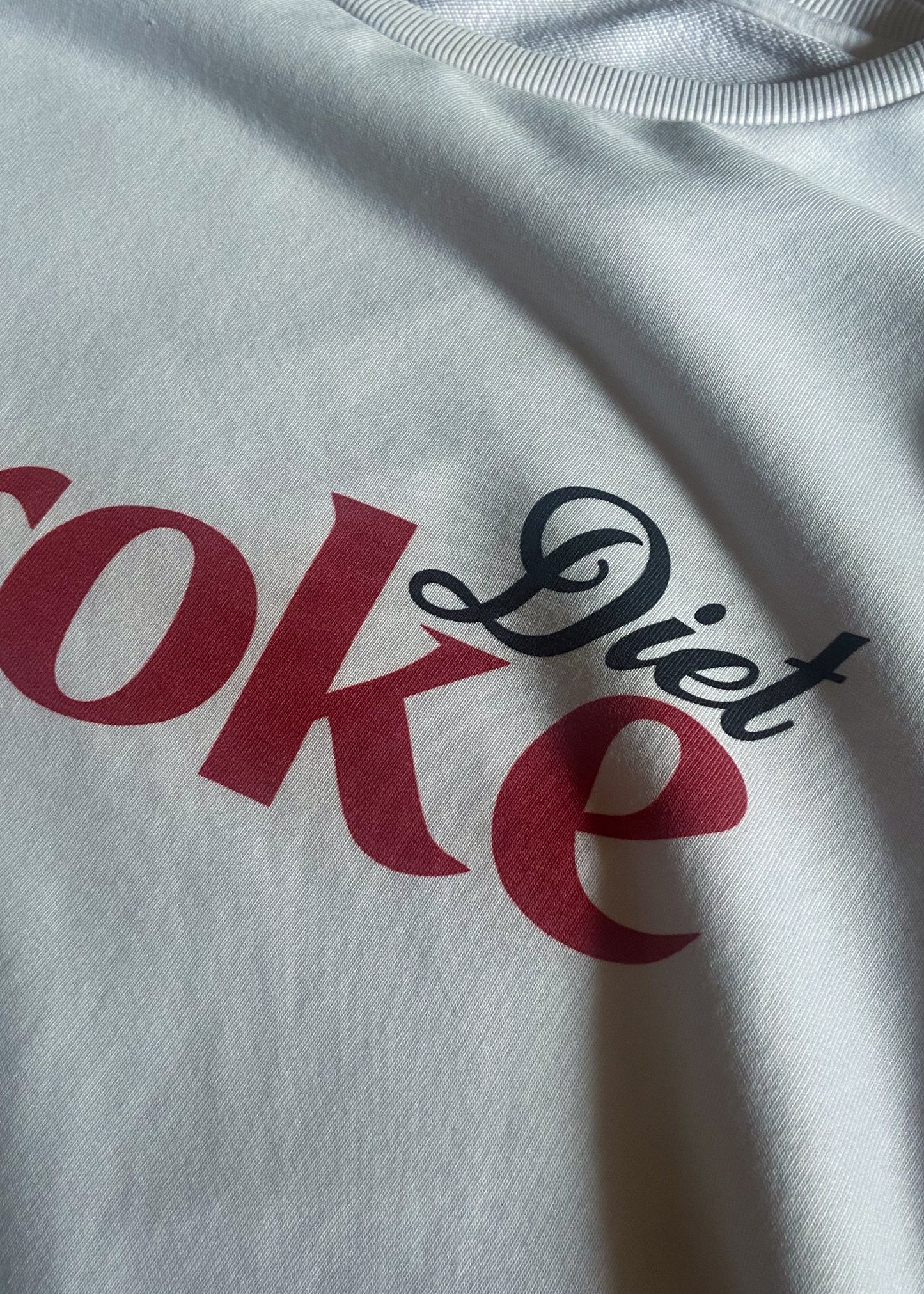 MIdphysiq (mid physique) Diet Broke Oversized gym T-shirt. Funny take on Diet Coke logo. Closeup of front print.
